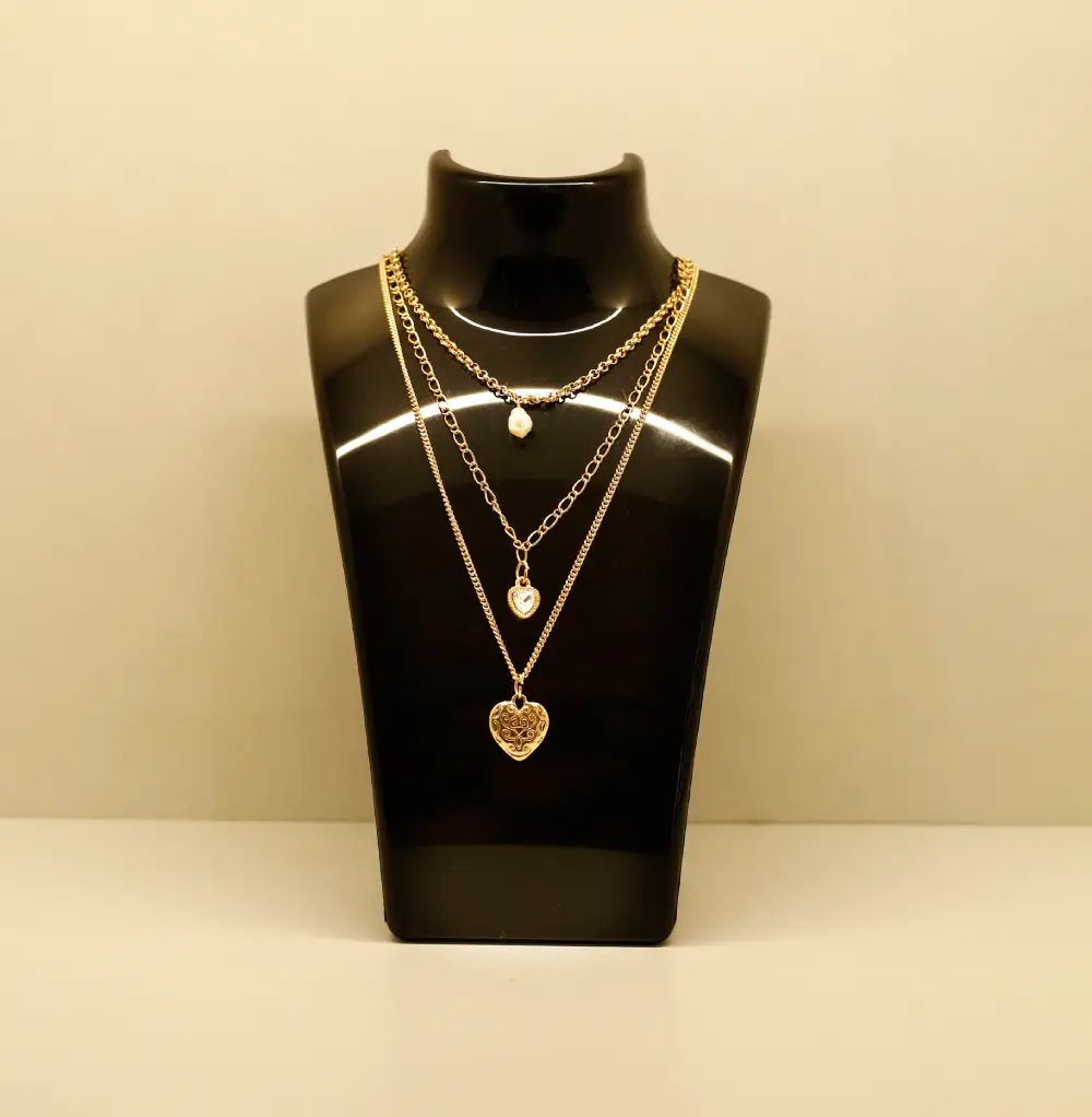 Necklace and pendant on a jewelry display bust