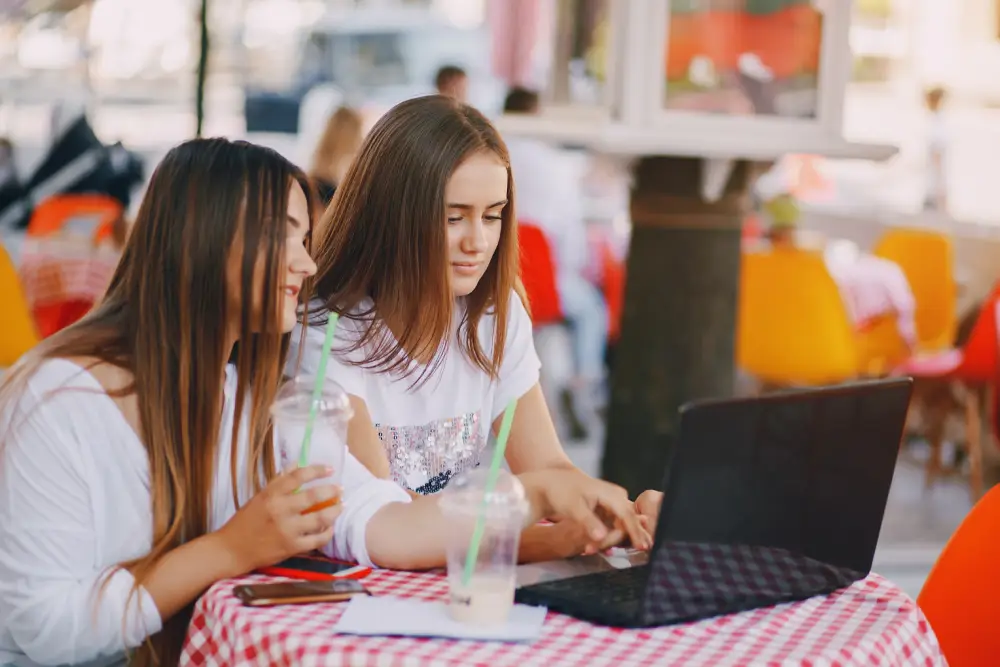Girls using a laptop together