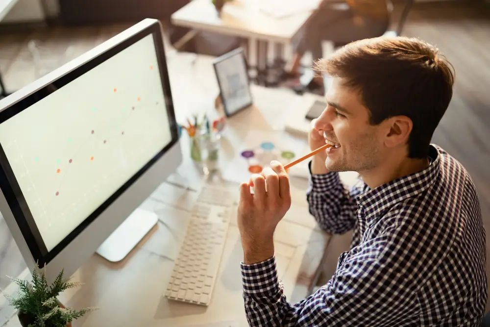 Entrepreneur reviewing monthly SEO progress on a computer