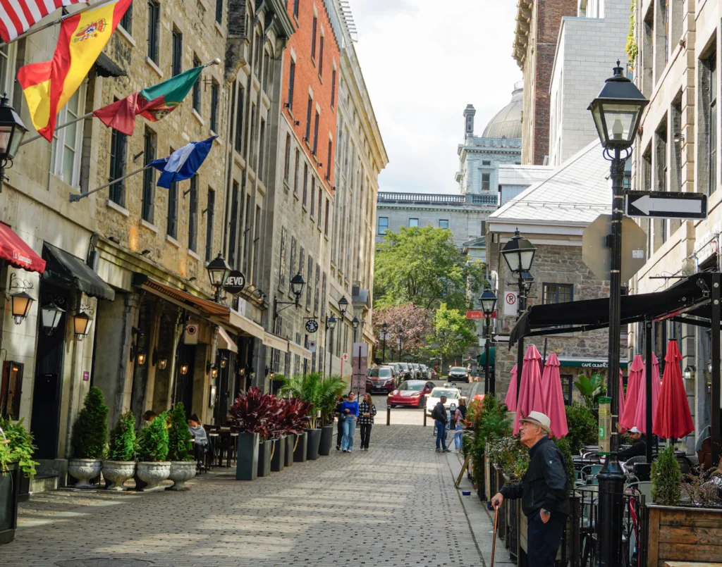 Cobblestone street with cafes and shops in Old Montreal
