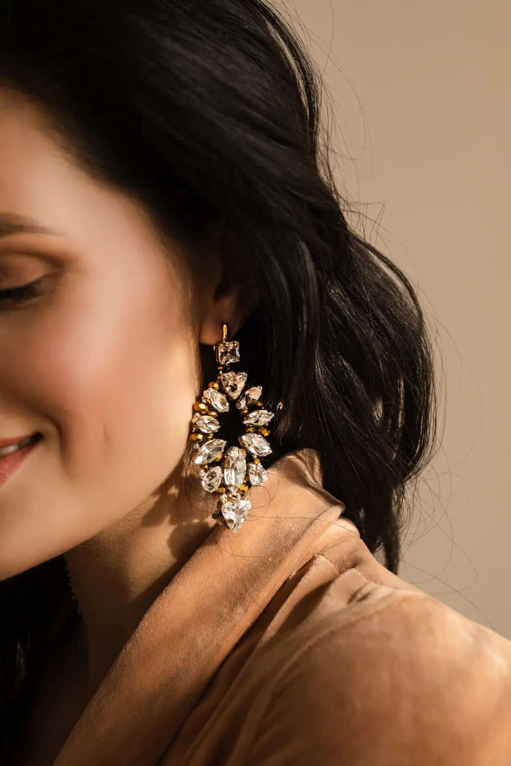 Young woman wearing gemstone earrings
